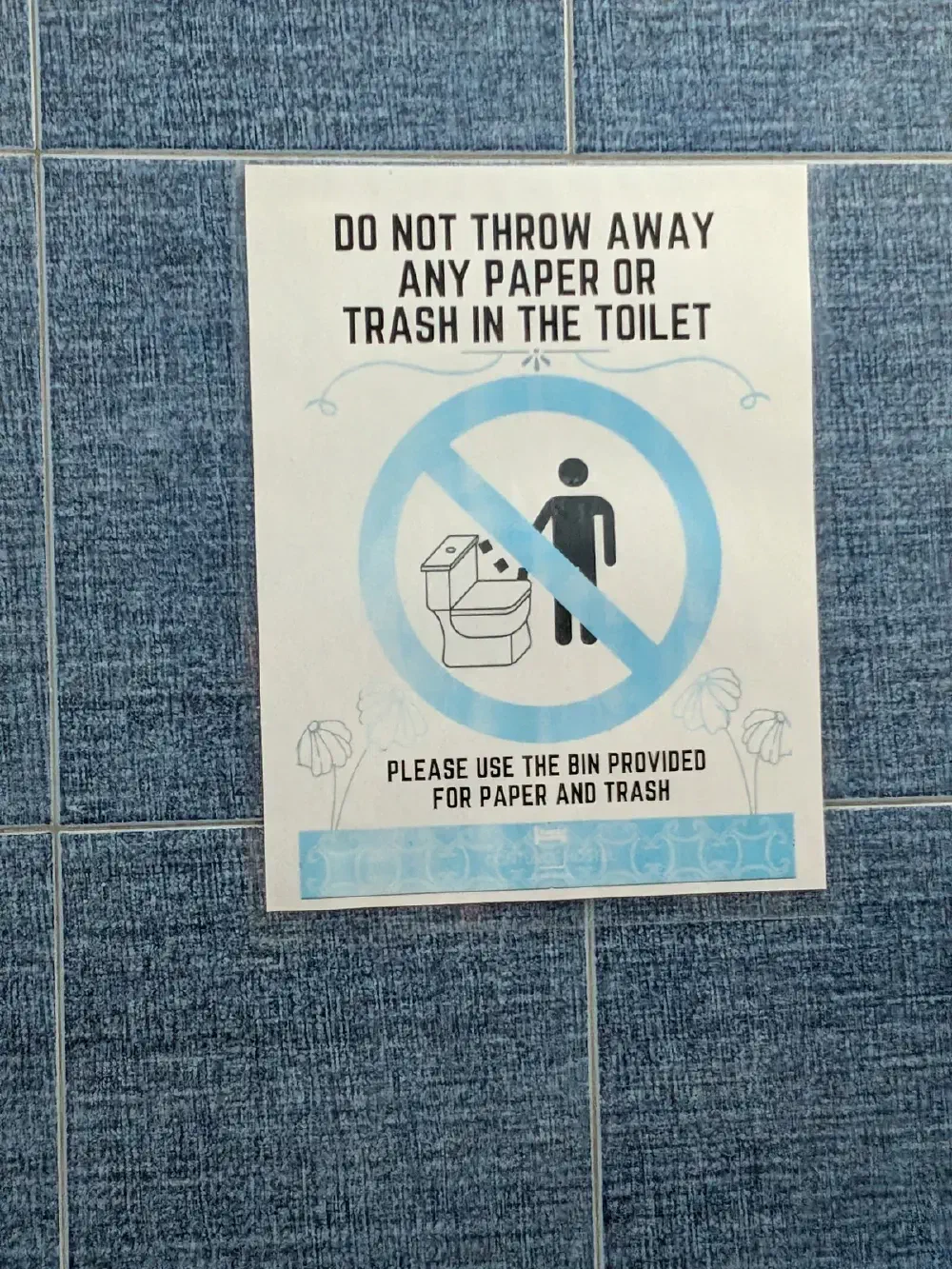 The sign — no paper in the toilet