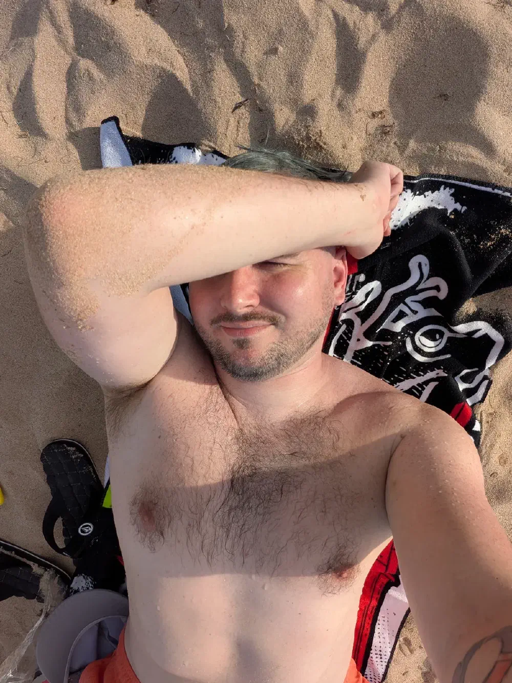 Lying back on the sand at Condado Beach
