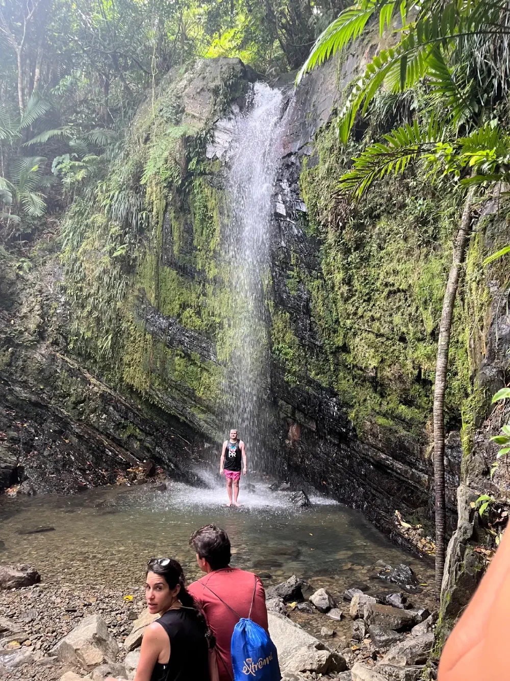 Waterfall spray hitting the rocky pool below