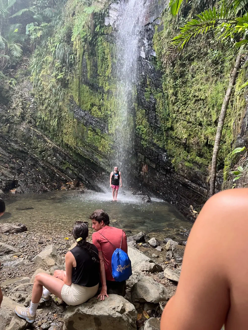 Waterfall cascading into a deep emerald pool
